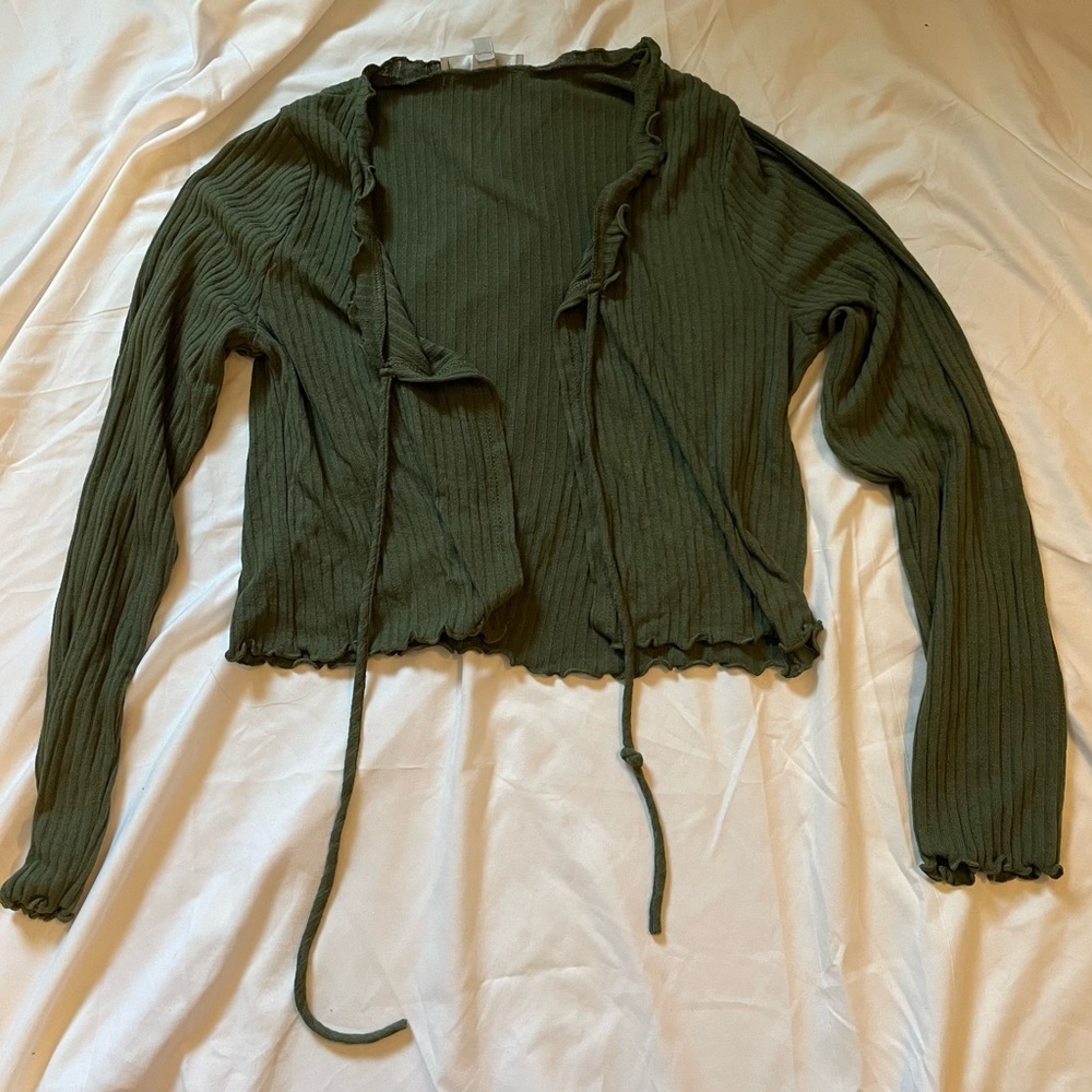 I am selling a green cover up shirt. It is a size small